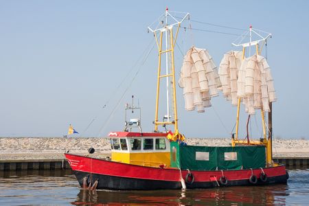 Fishing nets in top of fishery shipの写真素材