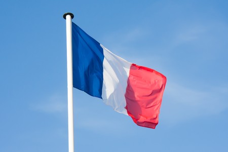 Beautiful French Flag blowing in the windの写真素材