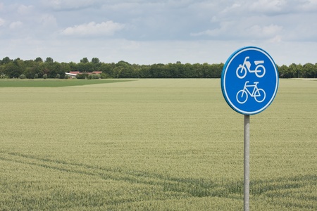 Traffic sign for bicycle and moped in rural landscapeの写真素材