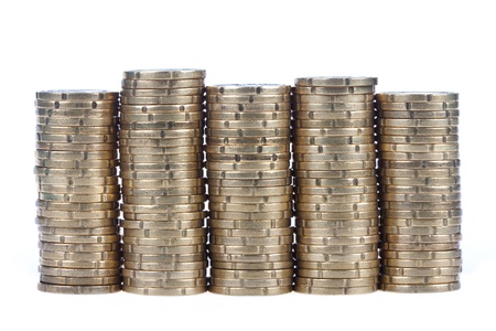 Piles of european 20 cent coins, isolated on a white backgroundの写真素材