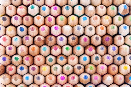 Front view of many colored wooden pencils