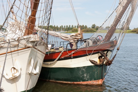 Bow of two old schooners in Dutch harbor Kampen