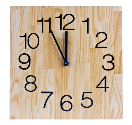 Wooden clock saying five to twelveの写真素材