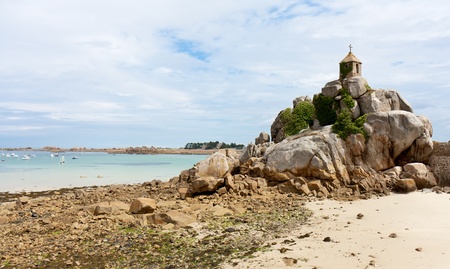 French coast of Brittany with a small chapel at the rocksの写真素材