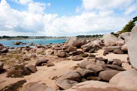 Ebb tide in bay at rocky coast of Brittany, Franceの写真素材