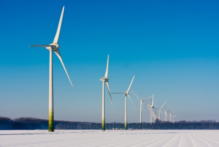 Rural winter landscape in the Netherlands with big windturbines