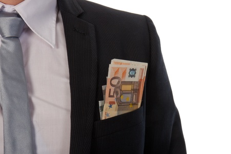 Businessman with money in his pocket; isolated on white