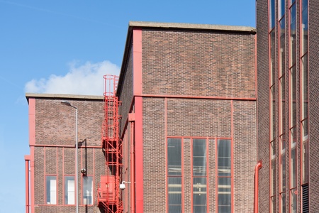 Facade from a big factory with nice red detailsの写真素材