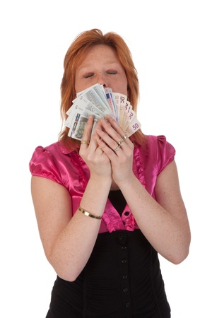 Beautiful young woman with money isolated on white backgroundの写真素材