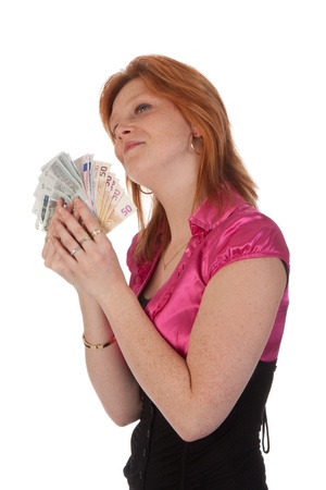 Beautiful young woman with money isolated on white backgroundの写真素材