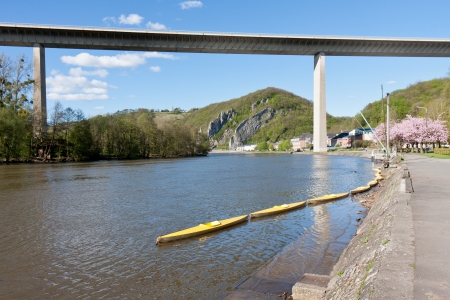 River Meuse near Dinant in Belgium, a highway is crossing te riverの写真素材