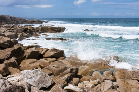 Waves breaking at rocky coast of Brittany, Franceの写真素材
