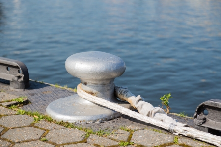 Bollard with rope at the quayの写真素材