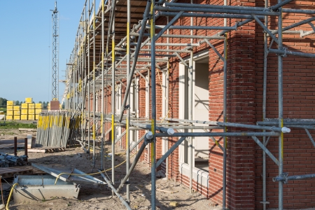Construction site with family houses in scaffoldingのeditorial素材