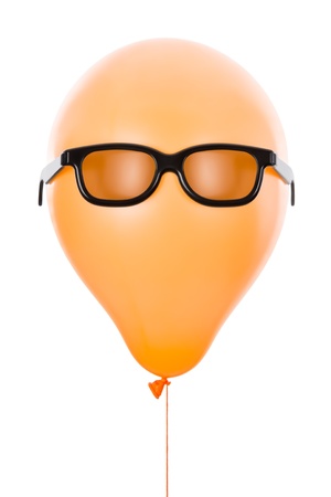 Orange balloon with sunglasses, isolated on whiteの写真素材