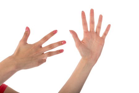 Female hands showing nine fingers isolated on white backgroundの写真素材