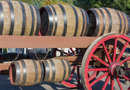 Wooden barrels at an old farm wagon in a countryside paradeの写真素材