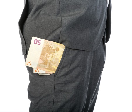 Closeup of Businessman with money in his pocketの写真素材