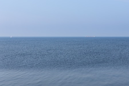 Endless Dutch sea with blue skyの写真素材