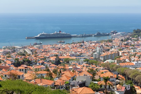 Aerial view of Portuguese Funchal with a big cruise ship in the harborの写真素材