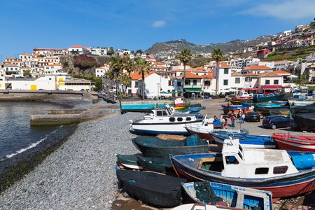 CAMARA DO LOBOS, PORTUGAL - MAY 05: Harbor with fishermen and fishing ships at the beach of Camara do Lobos on May 05, 2014 at Funchal, Portugalのeditorial素材