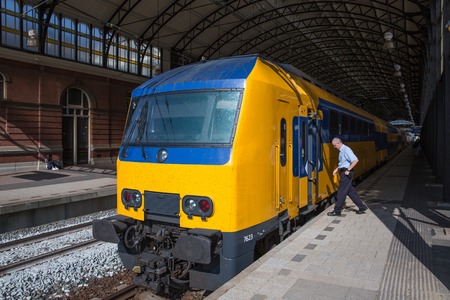 THE HAGUE, THE NETHERLANDS - SEP 18:  Conductor getting in a train ready to start at the train station of Holland Spoor on September 18, 2014 in The Hague, the Netherlandsのeditorial素材