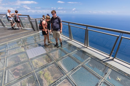 MADEIRA, PORTUGAL - AUG 04: Tourists visiting the glass observation deck at the cliffs of Gabo Girao...