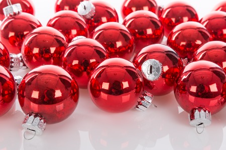 Red Christmas balls isolated over a white backgroundの写真素材