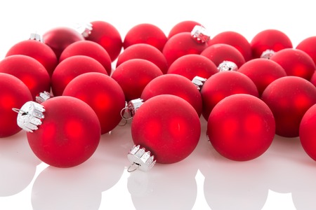 Red Christmas balls isolated over a white backgroundの写真素材