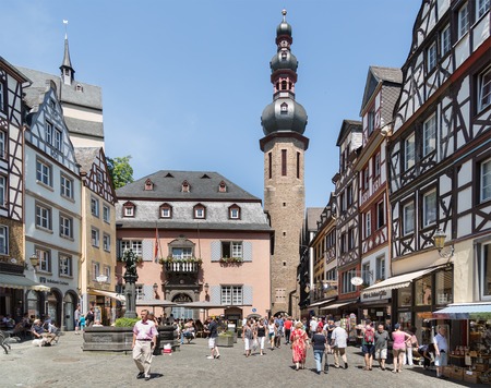 BERNKASTEL, GERMANY - JUL 24: Historic center of medieval city Bernkastel with unknown tourists shopping and sitting at terraces  on July 24, 2012 at Bernkastel, Germanyのeditorial素材