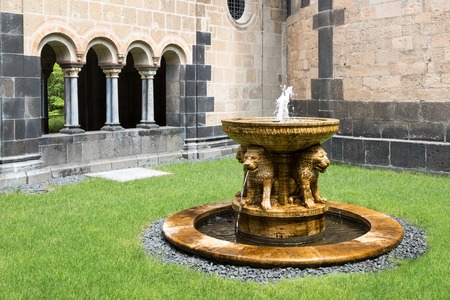 Fountain at courtyard old medieval benedictine Abbey in Maria Laach, Germanyのeditorial素材