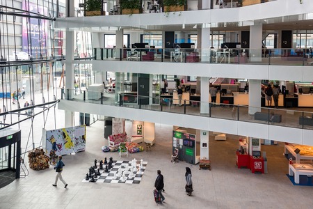 UTRECHT, THE NETHERLANDS - AUG 24: Atrium of the city hall of Utrecht with several floors and people visiting the building on August 24, 2015 in Utrecht, the Netherlandsのeditorial素材