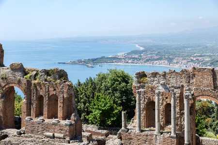 Ancient Greek theater of Taormina city with a panorama southward at the Sicilian island and the Mediterranean Seaの写真素材