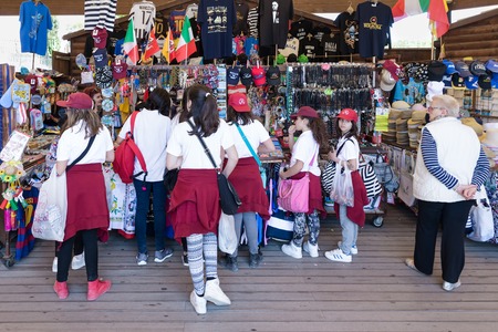 SIRACUSA ITALY - MAY 18: Gift shop with girl pupils on May 18, 2016 near the Greek theatre of Syracusa at the island Sicily, Italyのeditorial素材