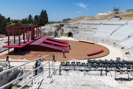 SIRACUSA, ITALY - MAY 18: Workers preparing a stage for a performance in the old Greek theatre of...