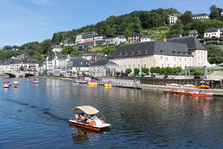 BOUILLON, BELGIUM - AUG 13: View at Bouillon with pedalos in river Semois on August 13, 2016 in Bouillon, Belgiumのeditorial素材
