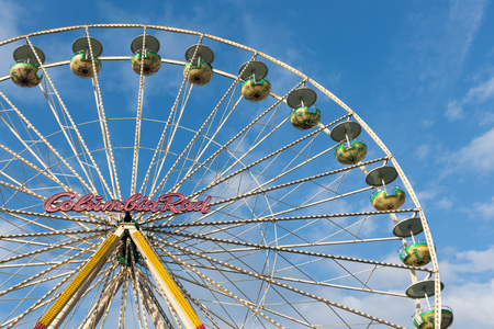 DUISBURG, GERMANY - DECEMBER 17, 2016: Ferris wheel against a blue sky at the Christmas fair in Duisburg, Germanyのeditorial素材