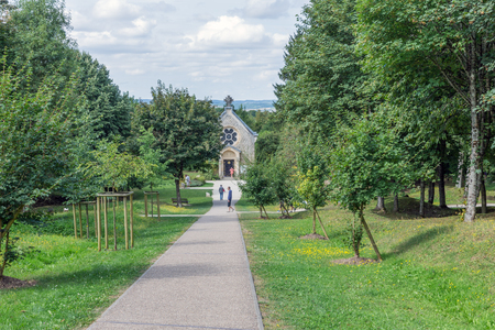 VERDUN, FRANCE - AUGUST 19, 2016: Tourists visiting a small chapel at the former place of the French village Fleury which was completely destroyed during  First World War Oneのeditorial素材