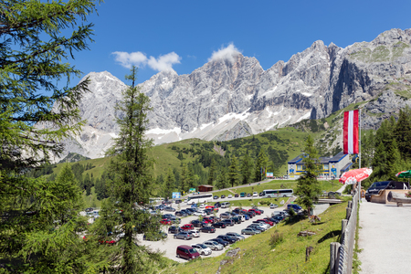 DACHSTEIN MOUNTAINS,  AUSTRIA - JULY 17, 2017: Car park near the valley station of the Dachstein glacier cable car in Austriaのeditorial素材