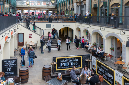 LONDON, ENGLAND - JUNE 08, 2017: Covent Garden market in London. This tourist attraction in London is famous about its restaurants, pubs, market stalls and shops.のeditorial素材