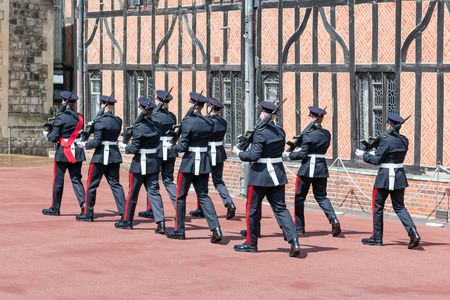 WINDSOR, ENGLAND - JUNE 09, 2017: Changing guard ceremony with marching soldiers in Windsor Castle,...