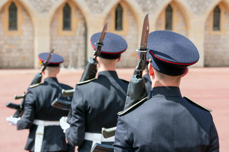 WINDSOR, ENGLAND - JUNE 09, 2017: Changing guard ceremony with soldiers armed with rifles and bayonet  in Windsor Castle, country house queen of Englandのeditorial素材