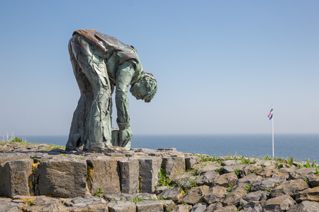 Afsluitdijk, The Netherlands - April 20, 2018: Statue of worker at Afsluitdijk. This is the separation of the salt Wadden Sea and the fresh water lake IJsselmeerのeditorial素材