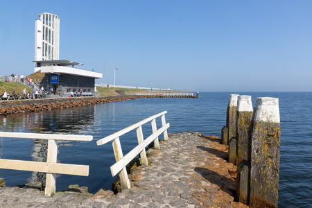 Wieringen, The Netherlands - April 20, 2018: Tourists visiting the monument at the location where the afsluitdijk is closed.のeditorial素材