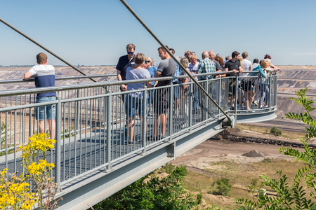 Garzweiler lignite mine, Germany - June 29 2018: People visiting viewpoint with skywalk at Garzweiler brown coal mine in Germanyのeditorial素材