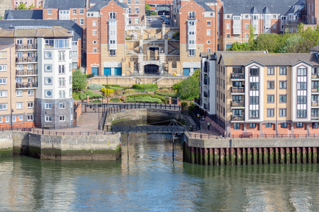 Newcastle, England - May 18 2018: Old dockyard in renovated residential area of Newcastle along Tyne riversideのeditorial素材