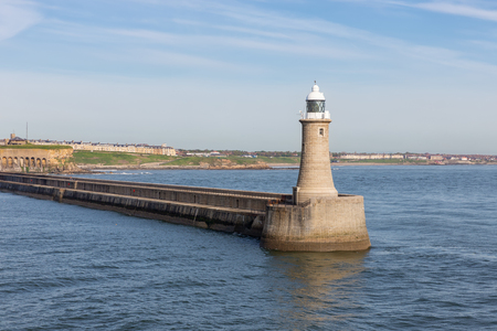 Newcastle, England- May 18, 2018: Lighthouse at ending of breakwater harbor Newcastle at river Tyneのeditorial素材