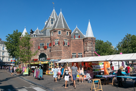 Amsterdam, The Netherlands - August 03, 2018: Nieuwmarkt square with medieval Waag building and people visiting a daily general goods market in the old centre of Amsterdamのeditorial素材