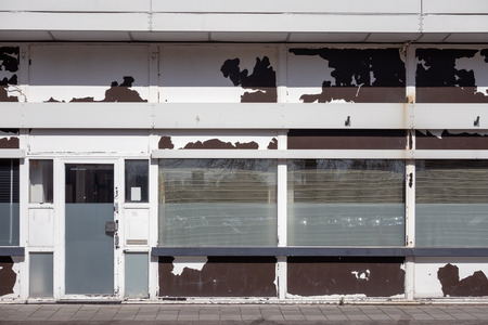 Facade of old abandoned business establishment in Lelystad, The Netherlands