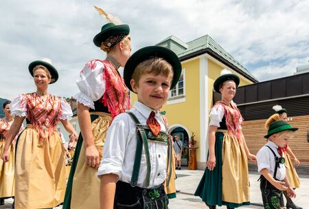 BERCHTESGADEN, GERMANY - JULY 09, 2017: Local festival with parade of fanfare and people dressed in traditonal costumes. Every village from the neighbourhoud has his own costumes.のeditorial素材